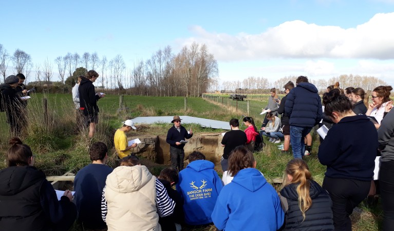 Roger talking to class