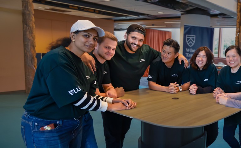buddies hug around table web